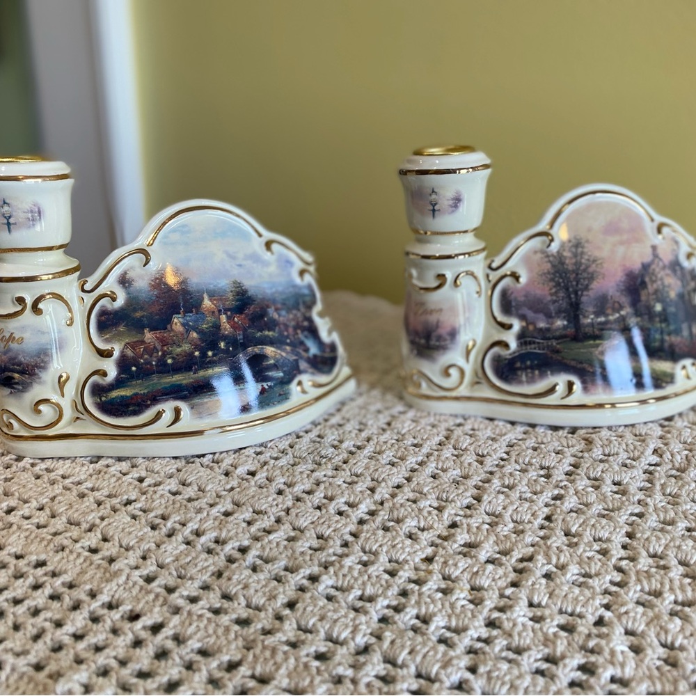 Pair of Thomas Kinkade Lighting the Way Home Candlestick holders, 2002.